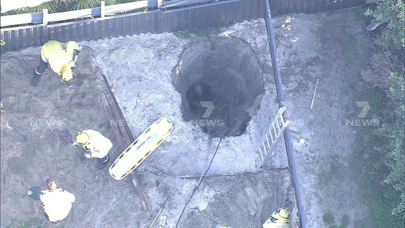 A desperate rescue operation is underway to save a man trapped in a 3m deep hole in Perth’s northern suburbs.