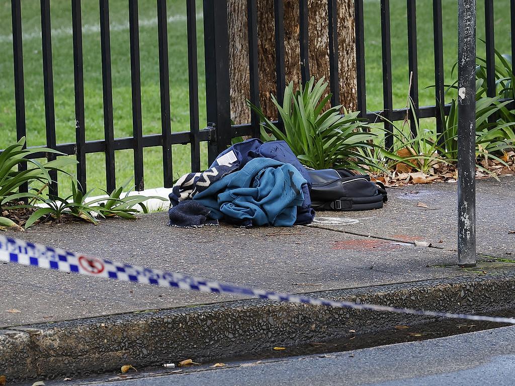 Items of clothing on the footpath linked to a suspected stabbing on the grounds of Sydney University at Camperdown. Picture: Richard Dobson