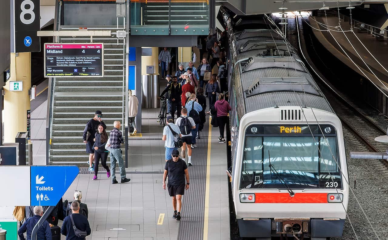 People waiting to board a train at the Perth train station