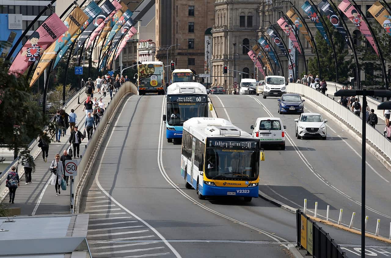 Buses going over a bridge.