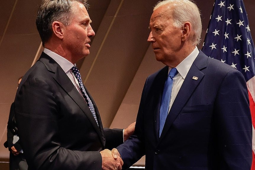 Richard Marles and Joe Biden shake hands.