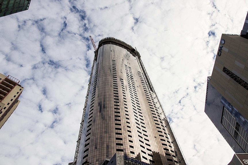 A tall apartment building under construction