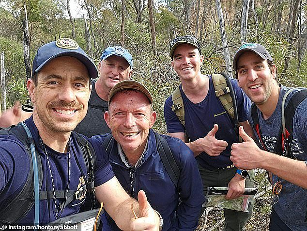 Tony Abbott is pictured, second left in the front, on an expedition with member of the Royal Fire Brigade last year