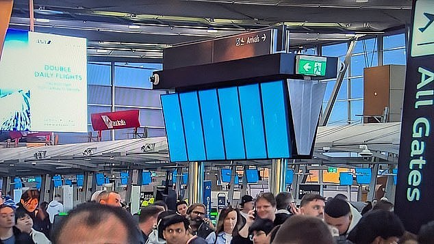 A global IT outage on Friday saw airline cancel flights, supermarket close their card-only self-serve checkouts and TV stations display 'blue screens of death' behind their newsreaders