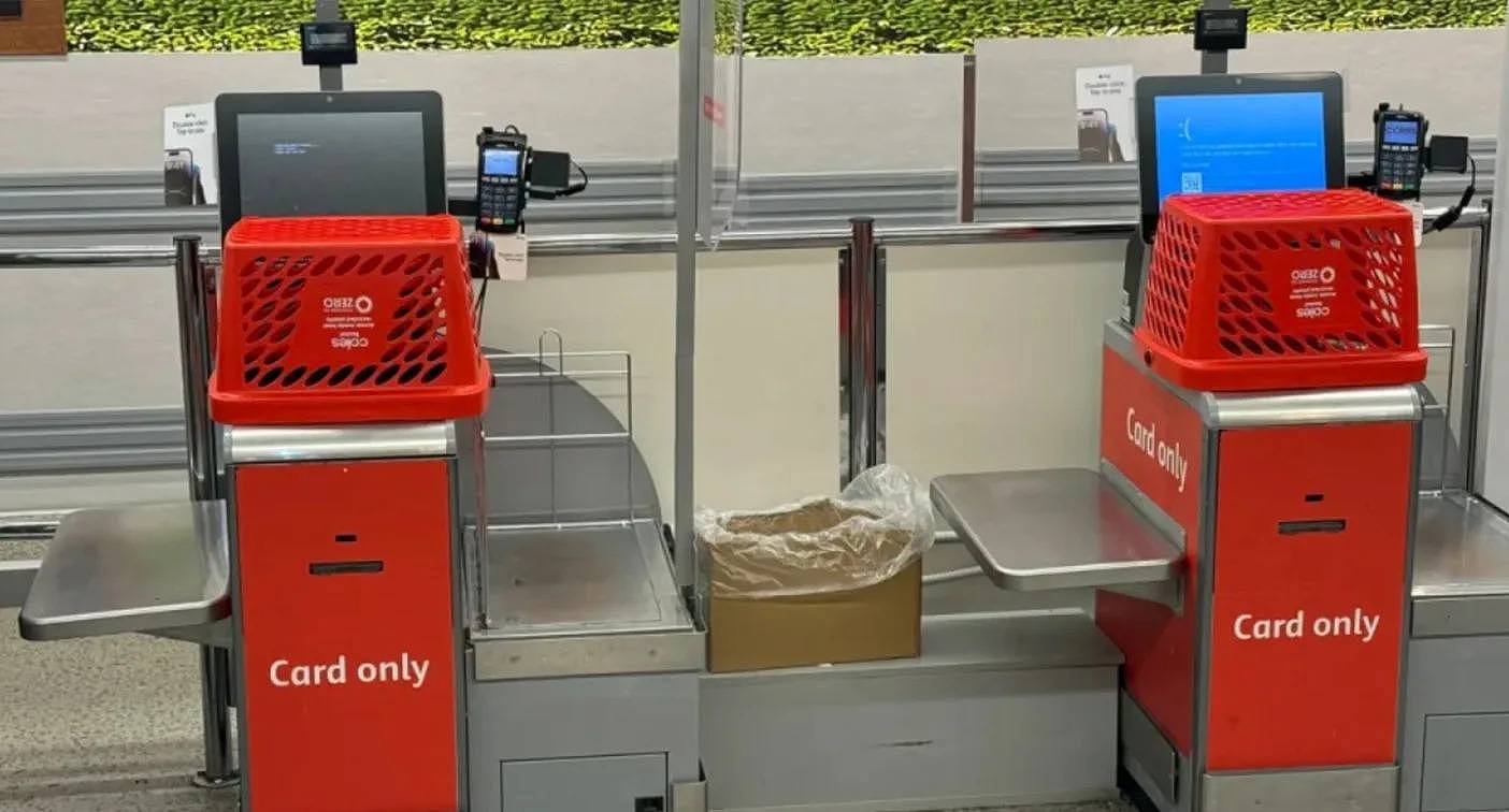 Coles supermarket self-serve checkouts not operating with baskets blocking them off due to global outage. 