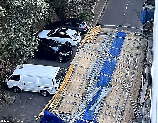 The three-storey wall of scaffolding was blown over on top of a car driving along Kangaroo Lane in Manly on Sydney's Northern Beaches about 4.20pm Saturday