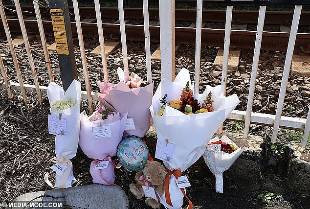 Tributes to the Anand Runwal and his two-year-old daughter Hilal have been left at the station