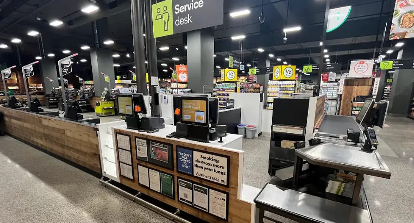 A checkout layout at Woolworths Spotswood showing an express lane to the right of many self-serve checkouts.