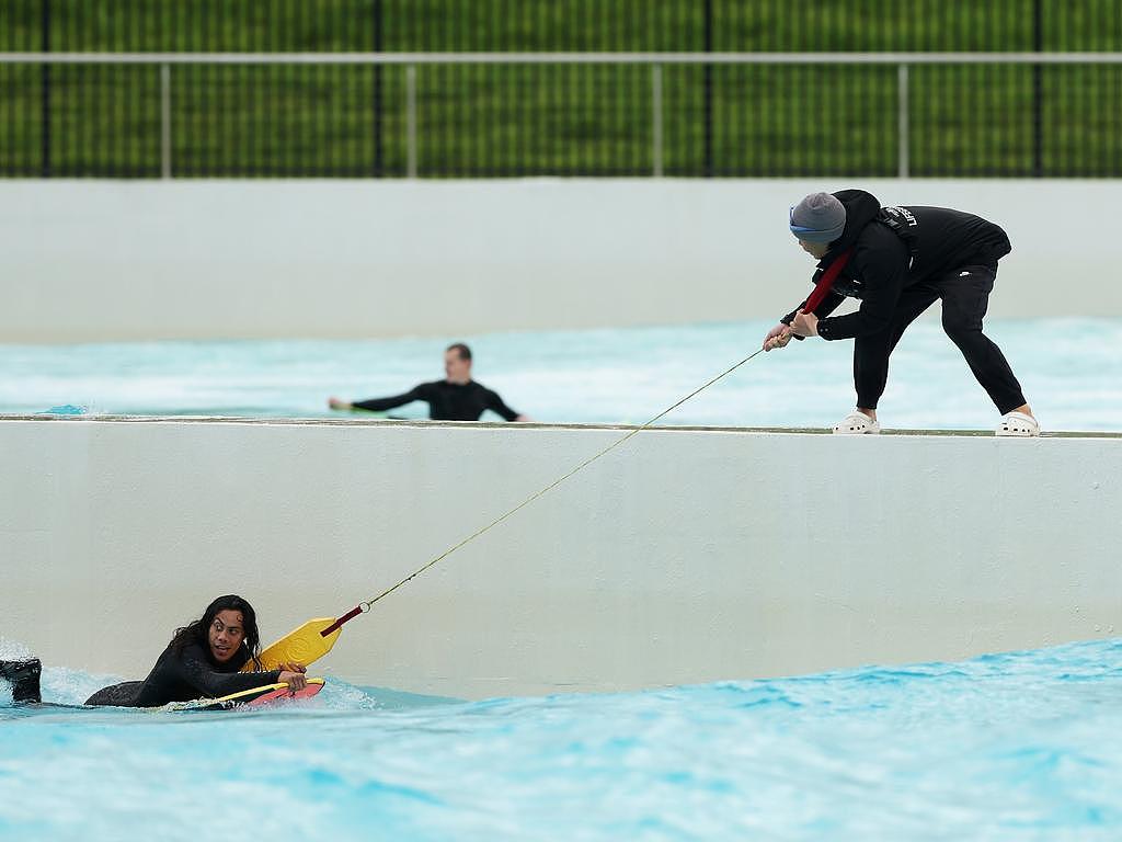 Jarome Luai is assisted from the wave pool earlier this month. Picture: Matt King/Getty Images