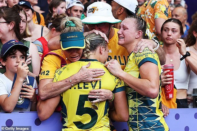 Pictured: Aussie stars are consoled by crowd members after going from one of the favourites to take out gold to leaving Paris empty-handed