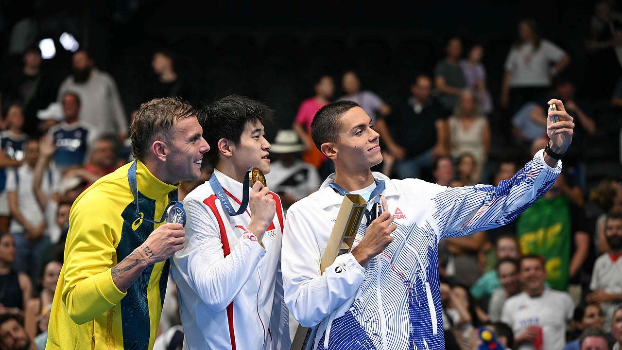 Kyle Chalmers, Pan Zhanle and Romania's David Popovici. Picture: Jonathan Nackstrand/AFP