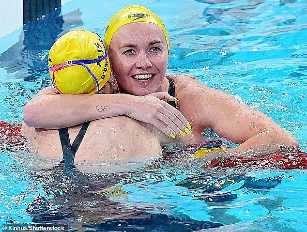 A fired up swimming fan has bizarrely suggested Aussie pool queen Ariarne Titmus has enjoyed a clear advantage over her rivals at the Paris Games - after painting her nails yellow (pictured)