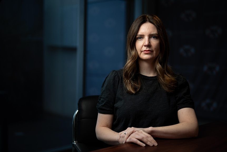 A portrait photo of a woman with dark hair.