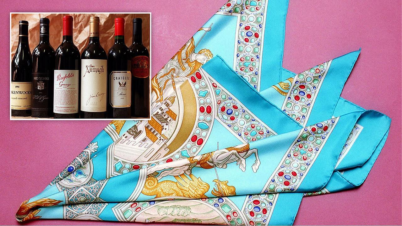 Gifts presented to bureaucrats include expensive Hermes scarfs and bottles of booze (the items pictured are not the actual items in the Premier’s Department room).