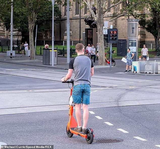 After a surge in complaints from residents and businesses, the City of Melbourne lord mayor will be putting a motion forward to cancel the contracts of e-scooter operators (pictured an e-scooter rider in Melbourne)