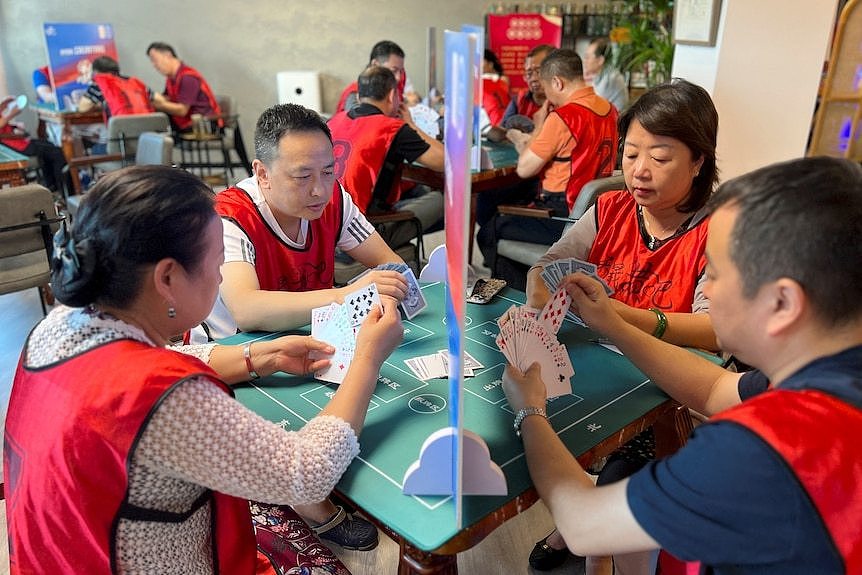 four players play a card game