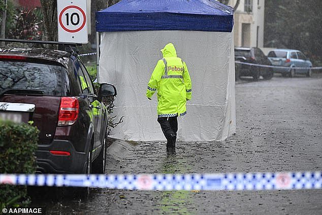 Police are seen at the scene of the young girl's death in Carrara on the Gold Coast on Wednesday