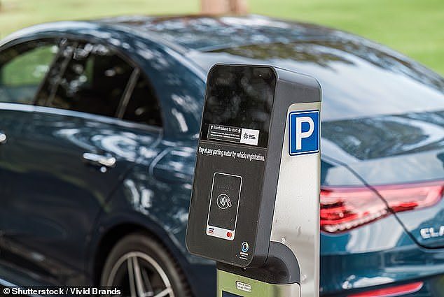 A car is pictured in Sydney beside a modern, cashless parking meter with a digital display