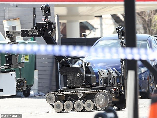 Police said the suspicious packaged found at the e Royal Brisbane and Women¿s Hospital contained food (stock image of police bomb squad robot pictured)