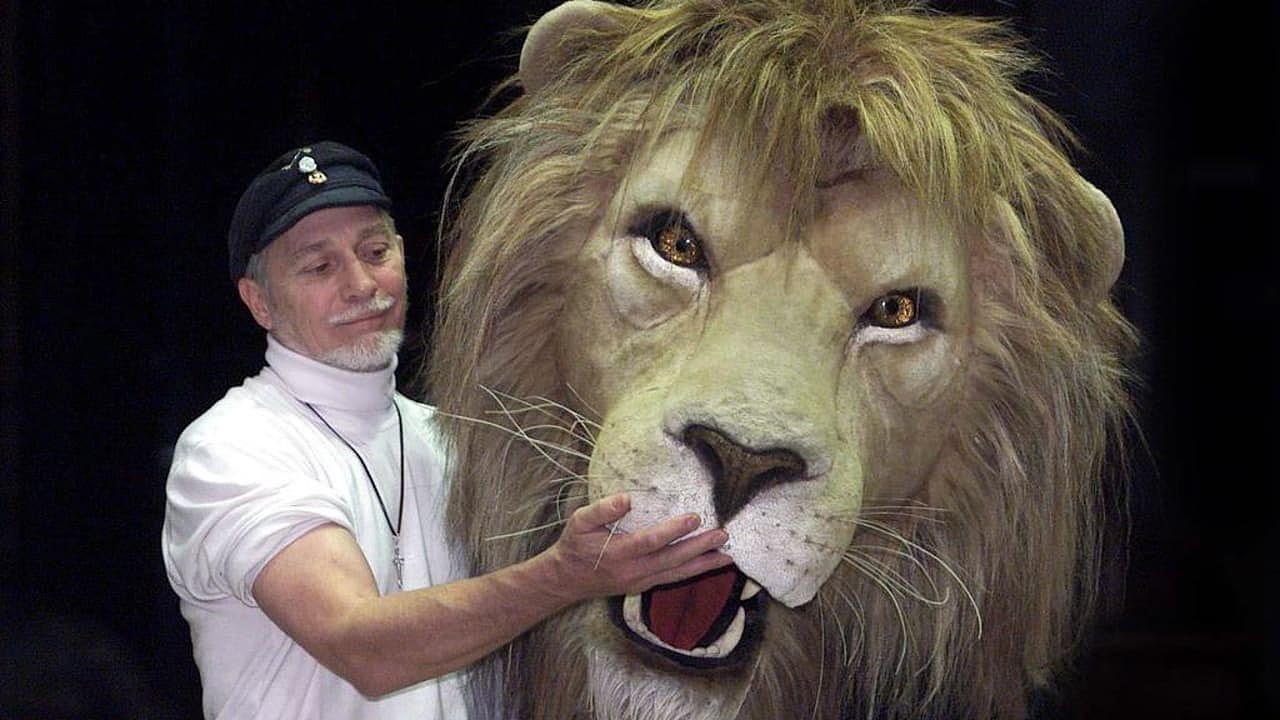 DECEMBER 19, 2002 : Douglas Gresham, creative director of step-father CS Lewis Estate tames a 3-metre long Aslan at State Theatre in Melbourne, 19/12/02 while in Australia to oversee stage production of Lewis's 