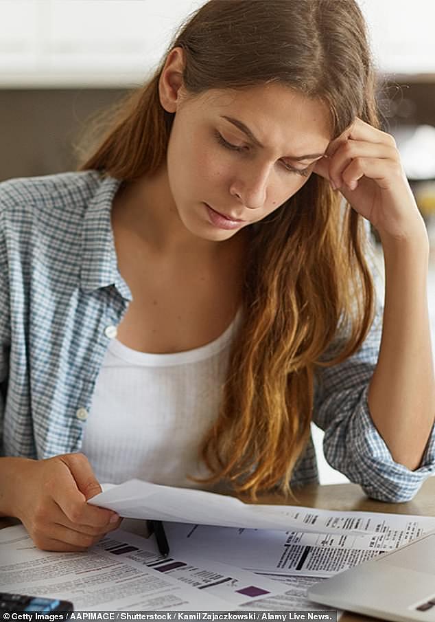 Peter de Cure, the Chair of the Tax Practitioners Board (TPB) - the body responsible for enforcing the new laws - has said that mental health 'could possibly be relevant' as a matter for disclosure to clients. Above, stock image of a woman doing her taxes