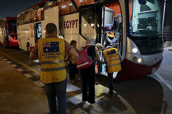 DFAT officials helping families travel to Cairo last year after leaving Gaza. The border is currently shut.