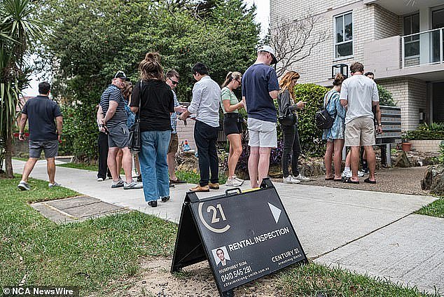 The rental crisis has hit Tasmania hard with tenants now paying an extra $7,000 annually in rent than they were five years ago (pictured, tenants lining up to look at a property)