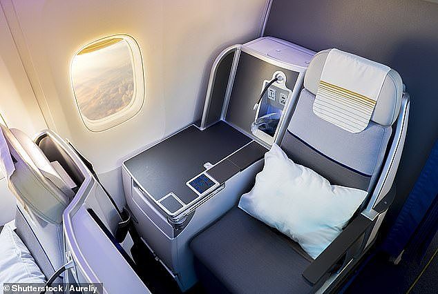 The man was in business class but wasn't watching any entertainment for the whole flight (stock image of a business class seat)