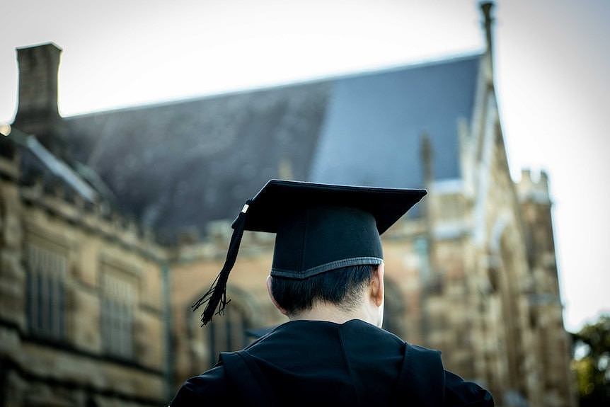 A man in graduation outfit.