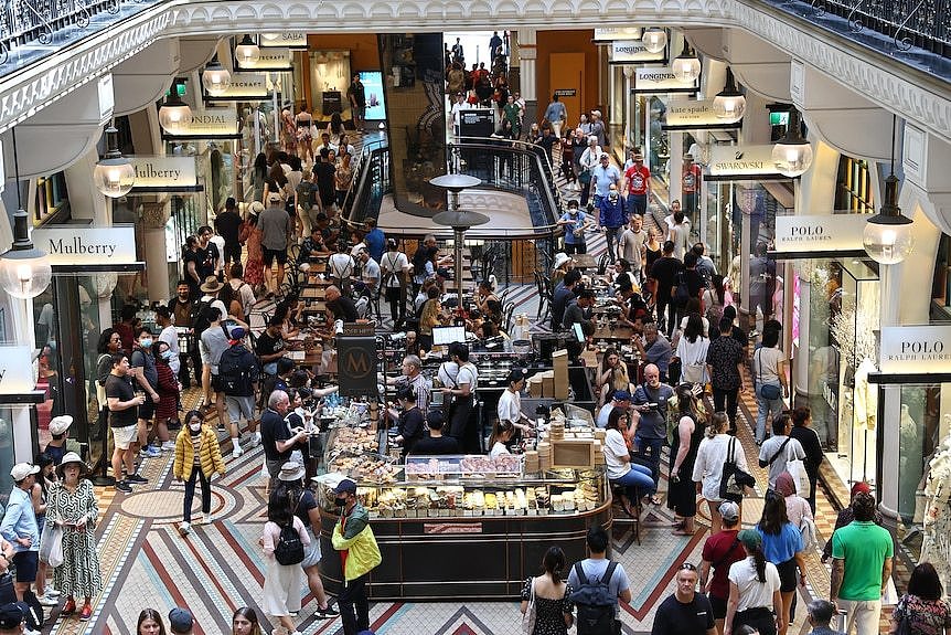 An overhead view of a busy mall filled with shoppers.