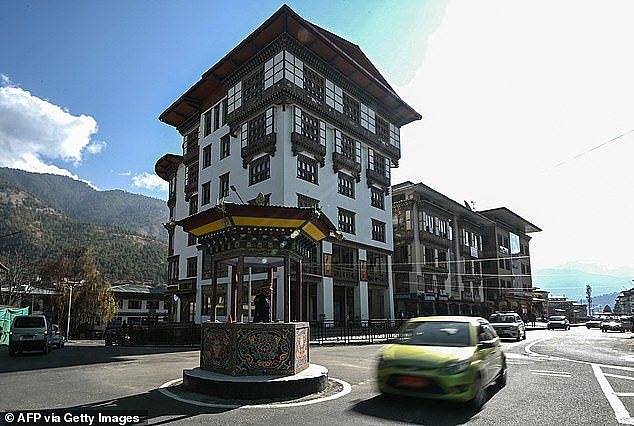 In this photograph taken on January 10, 2024, a traffic policeman directs traffic in Bhutan's capital Thimphu