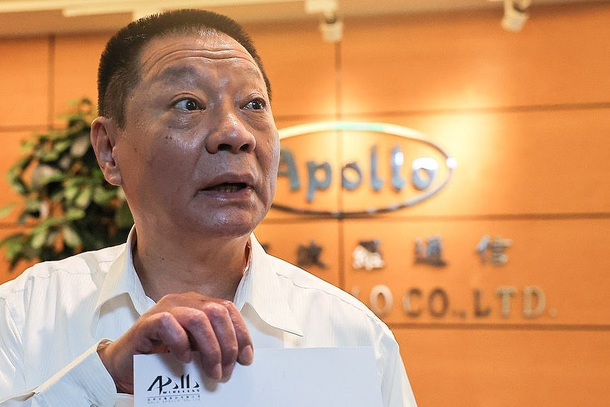 Hsu Ching-kuang, founder and president of Gold Apollo shows a company statement to the media at their office in New Taipei City