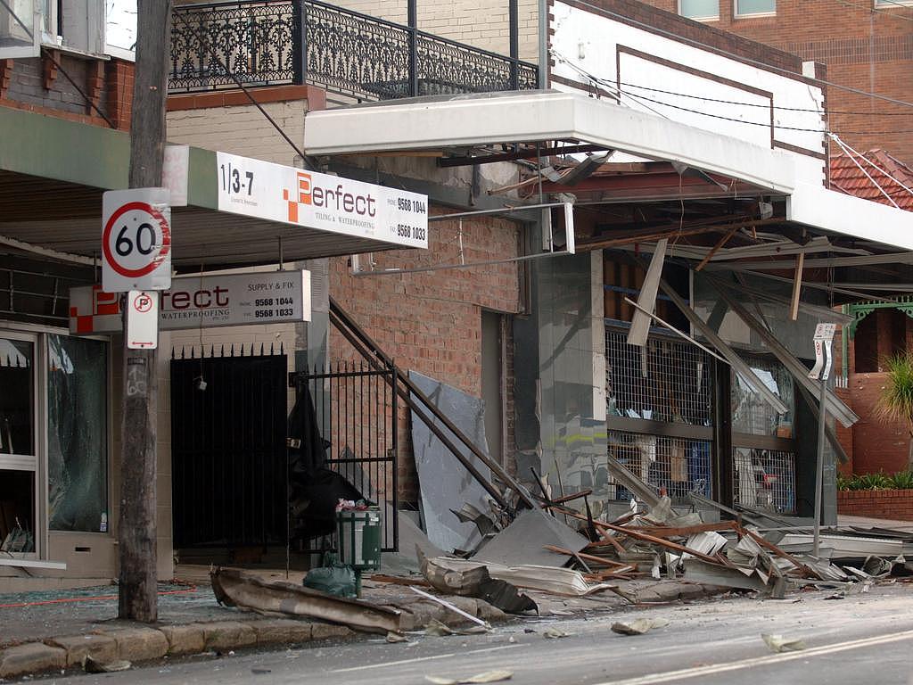 The wreckage of The Hells Angels clubhouse on Crystal Street, Petersham in Sydney, that was attacked overnight by a bomb explosion, blowing the front off the building and damaging many others in the area.