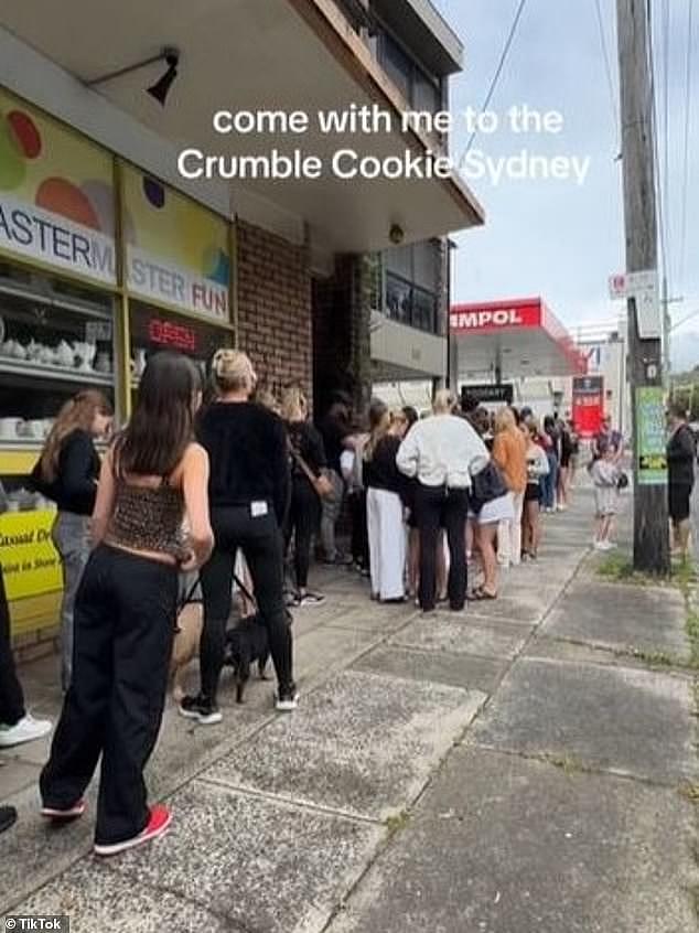 Customers waited 'hours' in line to try the famous Crumbl cookies but claimed the imported biscuits were 'stale' and 'underwhelming' (pictured, lines in North Bondi on Sunday)