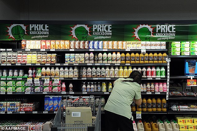 Many shoppers may not catch on to shrinkflation if they don't keep an eye on prices or the size of grocery items while doing their weekly shop (pictured, a Woolworths in Brisbane)