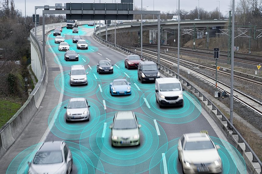 Photo illustration of autonomous self-driving cars on a highway.