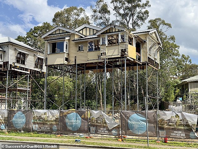 A  construction project in Brisbane has been dubbed the 'super Queenslander' after it required two homes to be lifted storeys high to make way for construction (pictured)