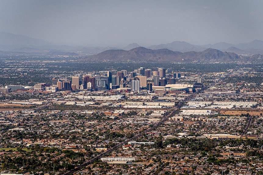 A city skyline in a desert setting.