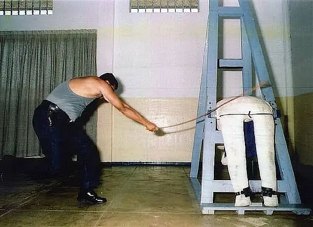 If convicted, he could face 12 lashings. Pictured is a prison officer at Changi Prison in Singapore demonstrating a caning on a mannequin