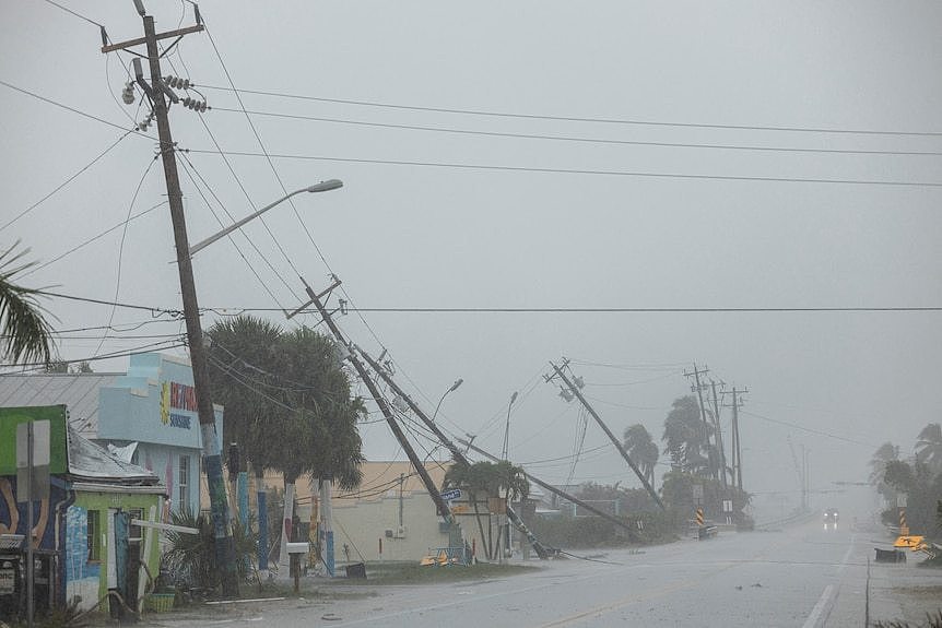 Broken utility poles downed by strong wind gusts.