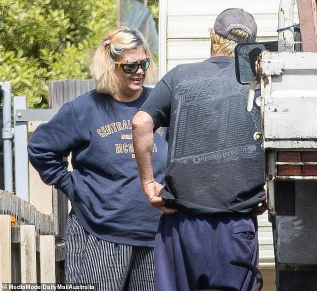 Pictured: Jacinta King and Jamie McCulloch outside their caravan on Thursday