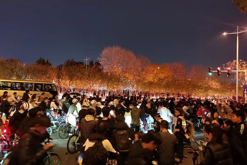 People on bikes at night.