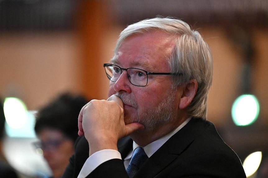 A close up image of Kevin Rudd with his hand on his chin. 