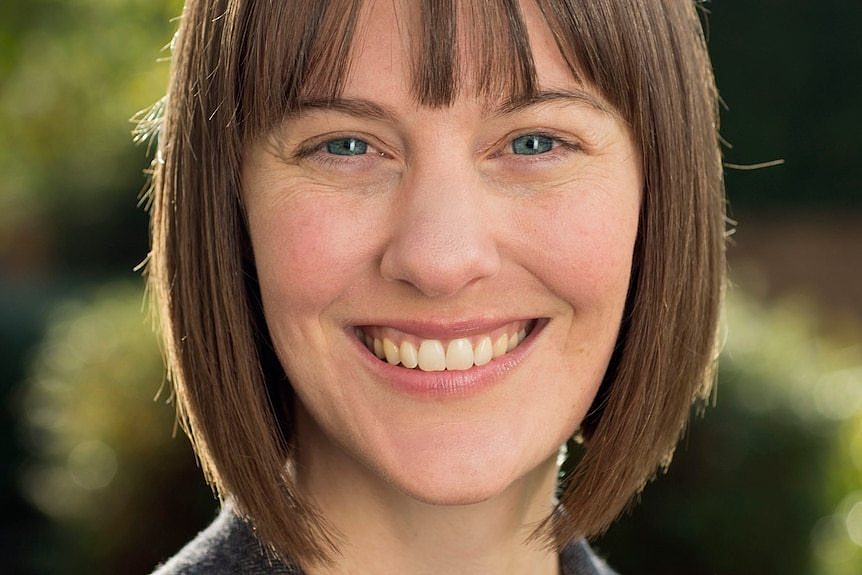 A headshot of Amy King