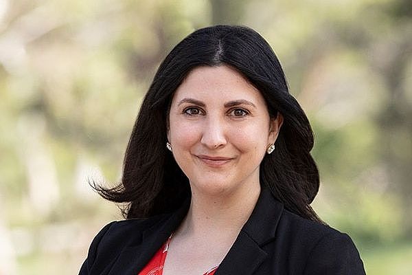 A woman stands for a professional political campaign portrait