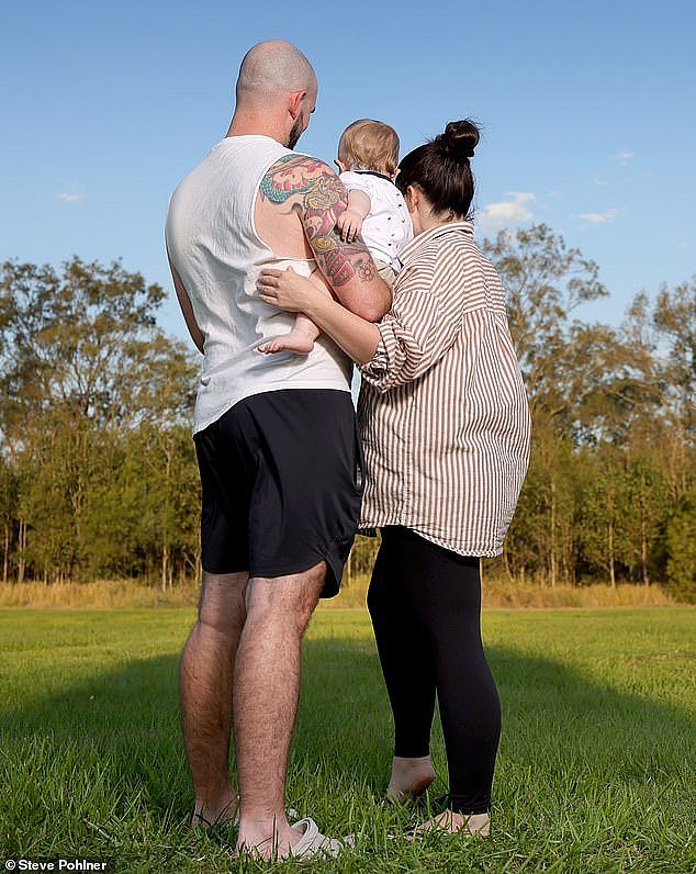 Baby Luka (pictured with his parents on September 20) suffered serious burns to 60 per cent of his body after a stranger doused him with hot coffee while he was at the park with his mum