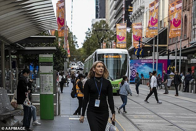 The Australian Bureau of Statistics (ABS) puts the gender wage gap at 11.5 per cent, based off the weekly earnings of full-time adults, but excluding part-time employees and overtime (pictured, an office worker on Bourke Street, Melbourne)