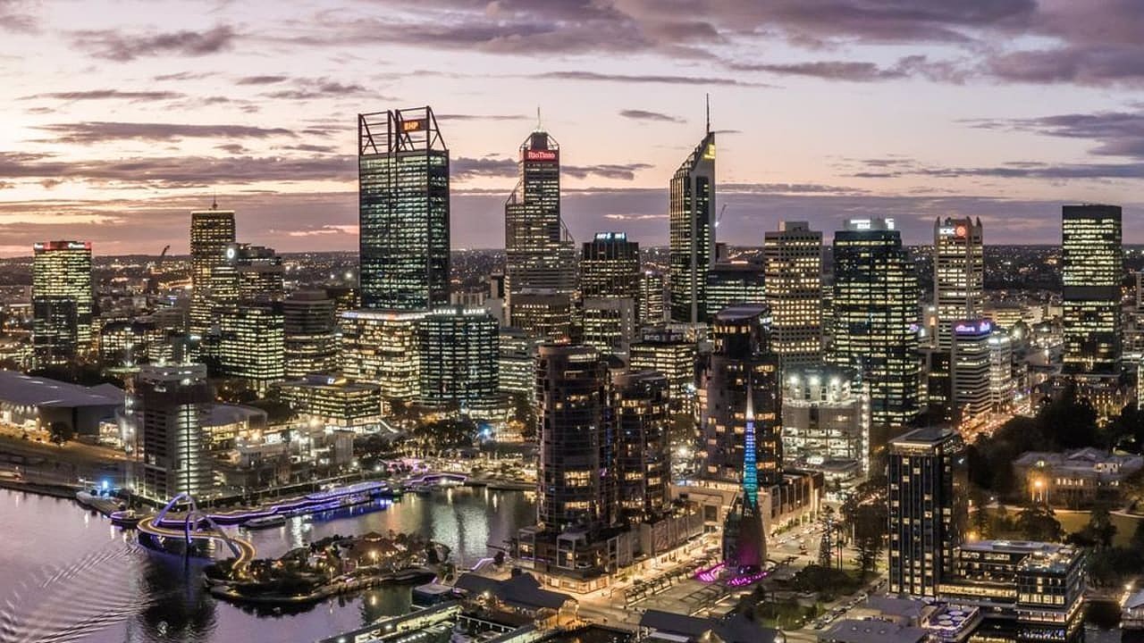 Aerial high angle drone view of Perth's CBD skyline with Elizabeth Quay in the foreground. Many mining companies are headquartered in Perth.