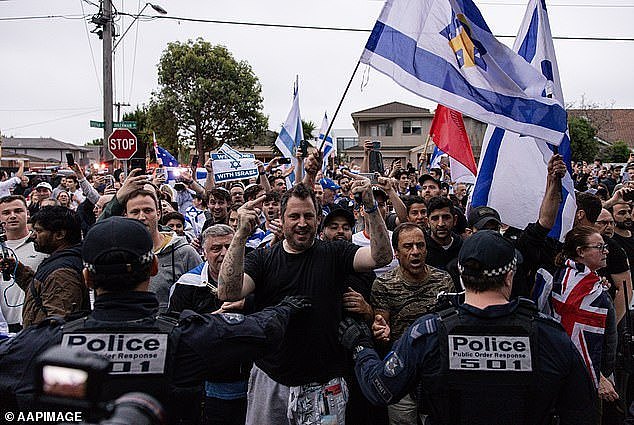 Pro-Israel activists gathered outside Caulfield Hebrew Congregation on Monday night following reports of a pro-Palestine protest, which was called off