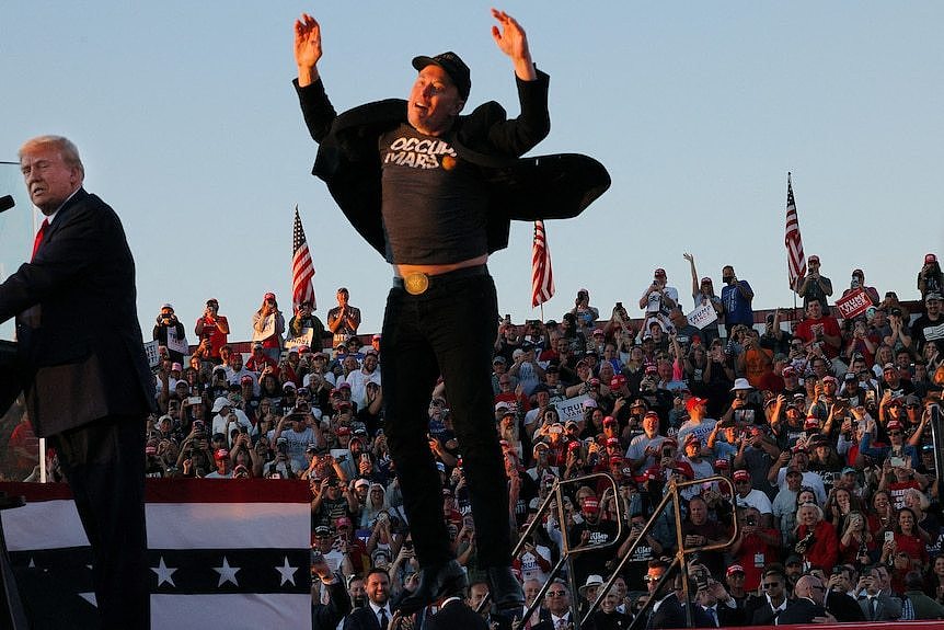 Elon Musk jumps at a Trump campaign rally